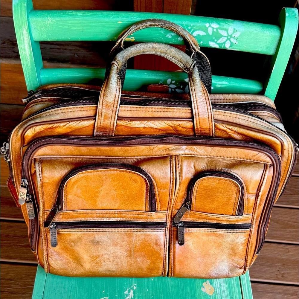 Vtg Avenue America worn in leather briefcase.